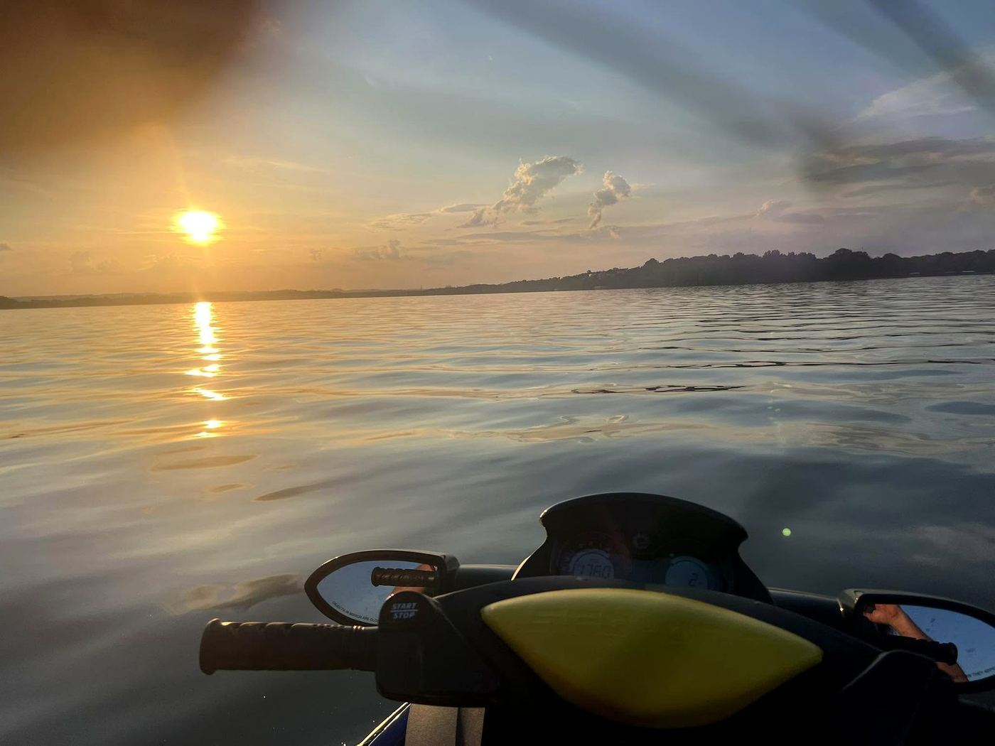 Golden sunset over Old Hickory Lake from an Aqua Time Rentals jet ski